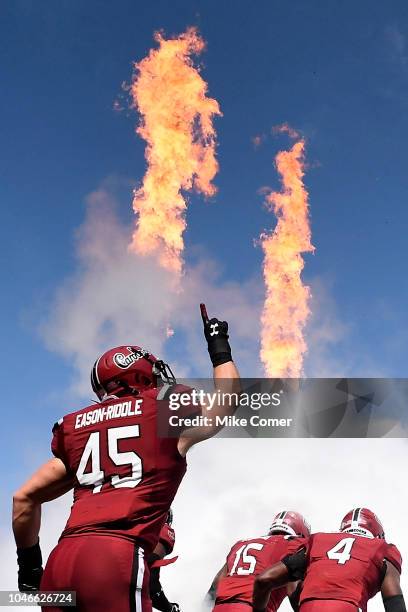 Linebacker Spencer Eason-Riddle of the South Carolina Gamecocks points to the sky as he runs on the field for the Gamecocks' football game against...