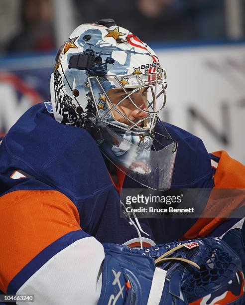 Rick DiPietro of the New York Islanders waits for a faceoff in his game against the New Jersey Devils at the Nassau Veterans Memorial Coliseum on...