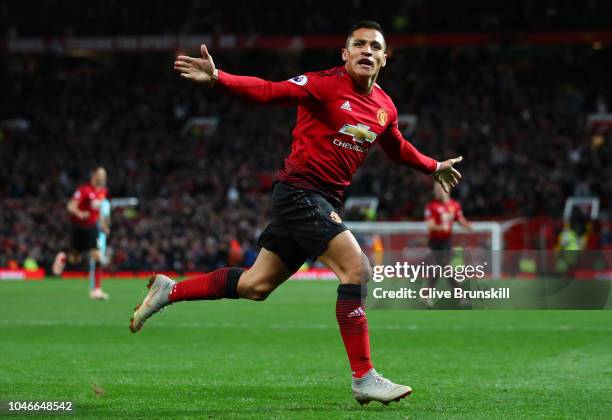 Alexis Sanchez of Manchester United celebrates after scoring his team's third goal during the Premier League match between Manchester United and...