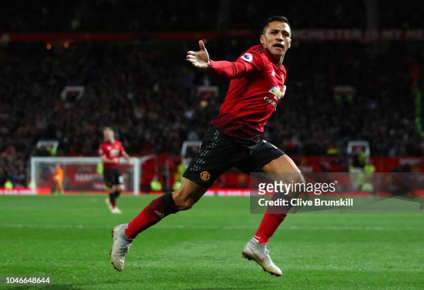 Alexis Sanchez of Manchester United celebrates after scoring his team's third goal during the Premier League match between Manchester United and...