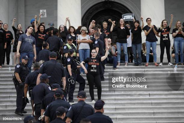 Demonstrators opposed to Supreme Court nominee Brett Kavanaugh are detained by U.S. Capitol police while protesting on the East Front of the U.S...