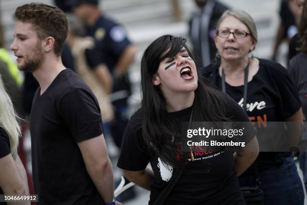 Demonstrators opposed to Supreme Court nominee Brett Kavanaugh are detained by U.S. Capitol police while protesting on the East Front of the U.S...