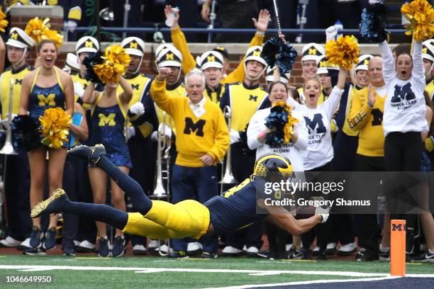 Ronnie Bell of the Michigan Wolverines dives for a first half touchdown while playing the Maryland Terrapins on October 6, 2018 at Michigan Stadium...