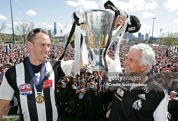 Magpies captain Nick Maxwell and coach Mick Malthouse hold the Premiership Cup aloft during the Collingwood Magpies AFL Grand Final reception at...