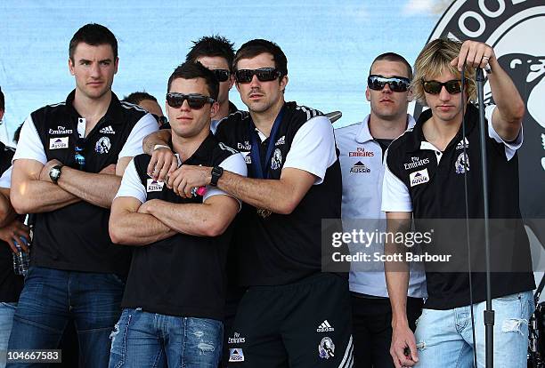 Collingwood players stand on the stage during the Collingwood Magpies AFL Grand Final reception at Gosch's Park on October 3, 2010 in Melbourne,...