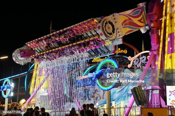 the fairground ride by night as oktoberfest attraction. munich, bavaria. - music of the spinning wheel stock pictures, royalty-free photos & images