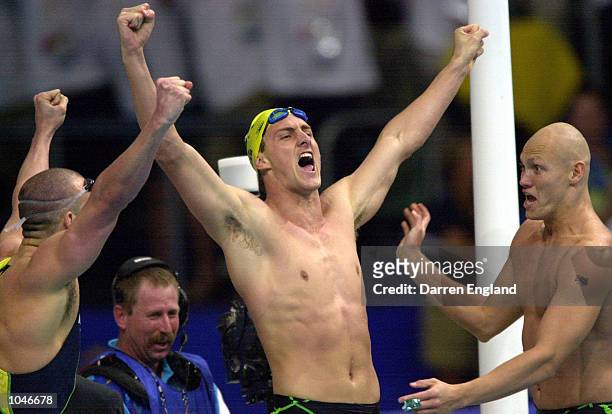 Ashley Callus, Chris Fydler, Michael Klim of Australia celebrate after breaking the Men's 4x100 Freestyle Relay World Record to Win Gold during the...