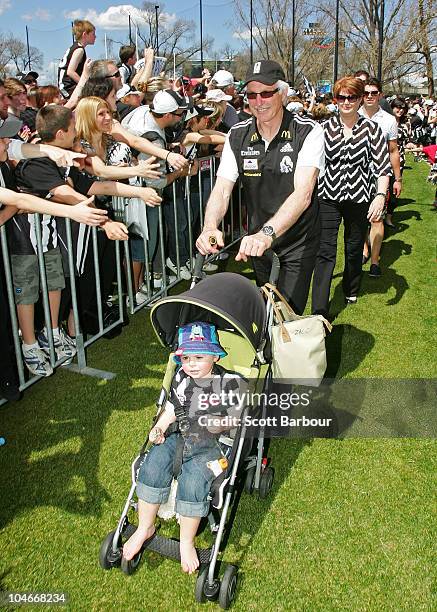 Magpies coach Mick Malthouse pushes his grandson Zac during the Collingwood Magpies AFL Grand Final reception at Gosch's Park on October 3, 2010 in...