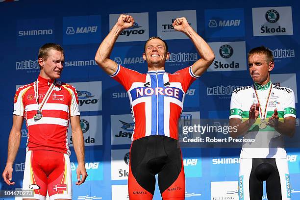 Matti Breschel of Denmark, Thor Hushovd of Norway and Allan Davis of Australia celebrate after the Elite Men's Road Race on day five of the UCI Road...