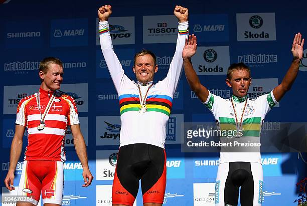 Matti Breschel of Denmark, Thor Hushovd of Norway and Allan Davis of Australia celebrate after the Elite Men's Road Race on day five of the UCI Road...