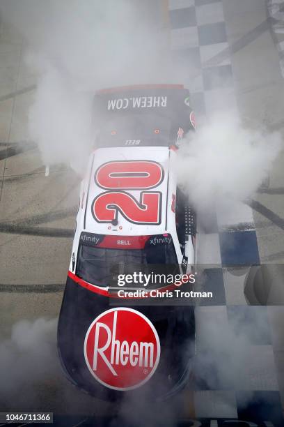 Christopher Bell, driver of the Rheem Toyota, celebrates with a burnout after winning the NASCAR Xfinity Series Bar Harbor 200 presented by Sea Watch...