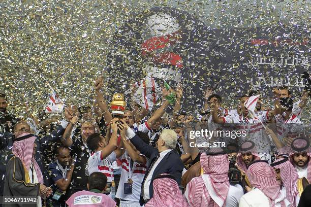 Zamalek players celebrate after winning the first leg of the Saudi and Egypt super match between Saudi's Al Hilal and Egypt's Zamalek at the King...