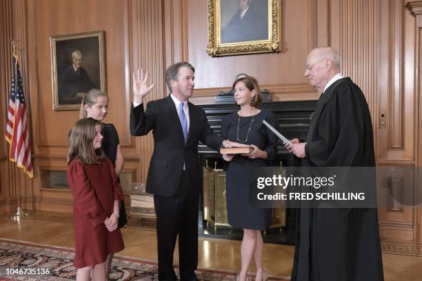 Justice Anthony M. Kennedy, administers the Judicial Oath to Judge Brett M. Kavanaugh in the Justices Conference Room, Supreme Court Building,...