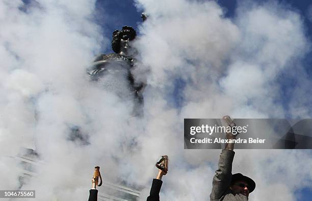 Traditional Bavarian riflemen and shoot during a parade in front of the famouse scupture called 'Bavaria' during the Oktoberfest at Theresienwiese on...