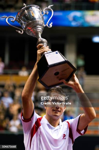 Guillermo Garcia-Lopez of Spain celebrates with the trophy after winning the singles final match against Jarkko Nieminen of Finland on Day 9 of the...