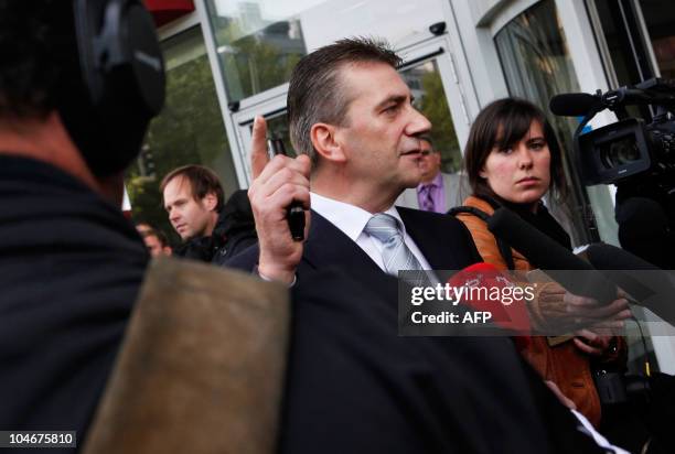 Former CDU representative Rene Stadtkewitz speaks to journalists as he arrives at a hotel in Berlin where Dutch right-wing party PVV Geert Wilders...