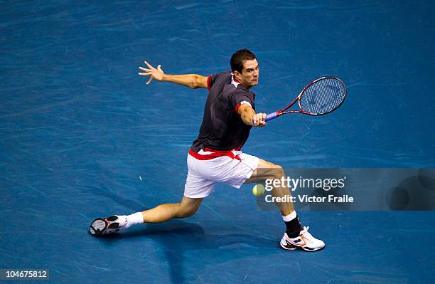 Guillermo Garcia-Lopez of Spain returns a ball to Jarkko Nieminen of Finland in the singles final match on Day 9 of the PTT Thailand Open at Impact...