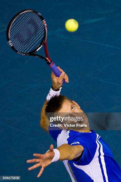 Jarkko Nieminen of Finland serves to Guillermo Garcia-Lopez of Spain in their singles final match on Day 9 of the PTT Thailand Open at Impact Arena...