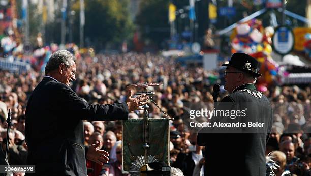 Christian Ude , mayor of Munich, speaks to visitors during the traditional riflemen parade during the Oktoberfest at Theresienwiese on October 3,...
