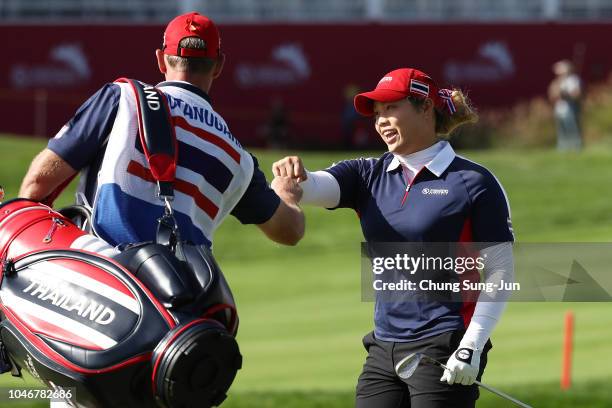 Ariya Jutanugarn of Thailand celebrates her chip-in eagle to win the Wild-Card Playoff on the 14th hole on day four of the UL International Crown at...