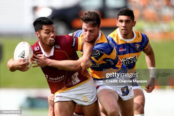 Ray Nu'u of Southland is tackled by Kaleb Trask of Bay of Plenty during the round eight Mitre 10 Cup match between Southland and Bay of Plenty at...