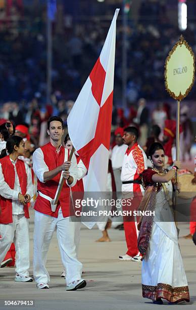 England athletes led by flagbearer Nathan Robertson take part in the opening ceremony of the XIX Commonwealth Games in New Delhi on October 3, 2010....