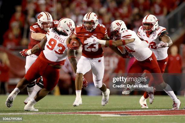 Jonathan Taylor of the Wisconsin Badgers runs with the ball in the third quarter against the Nebraska Cornhuskers at Camp Randall Stadium on October...