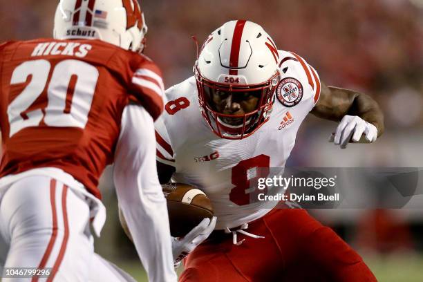 Stanley Morgan Jr. #8 of the Nebraska Cornhuskers runs with the ball while being chased by Faion Hicks of the Wisconsin Badgers in the second quarter...