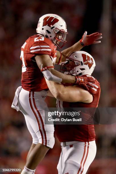 Jonathan Taylor and Tyler Biadasz of the Wisconsin Badgers celebrate after scoring a touchdown in the second quarter against the Nebraska Cornhuskers...
