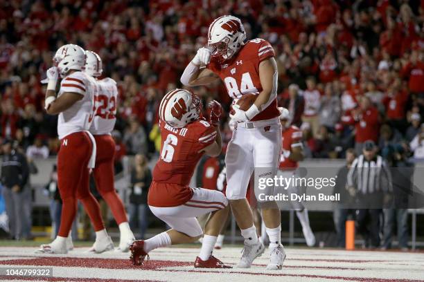 Danny Davis III and Jake Ferguson of the Wisconsin Badgers celebrate after Ferguson scored a touchdown in the second quarter against the Nebraska...