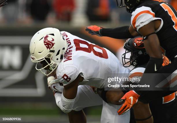 Washington State wide receiver Easop Winston runs the ball during a college football game between the Oregon State Beavers and Washington State...