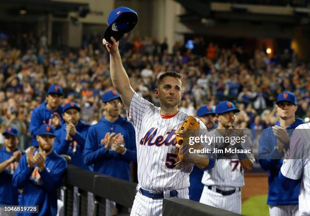 David Wright of the New York Mets acknowledges the crowd as he is removed from the final game of his career during the fifth inning against the Miami...