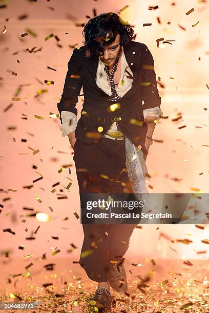 Designer John Galliano walks the runway during the John Galliano Ready to Wear Spring/Summer 2011 show during Paris Fashion Week at Opera Comique on...