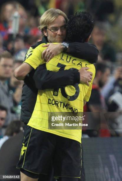 Juergen Klopp, head coach of Dortmund celebrate with Lucas Barrios during the Bundesliga match between Borussia Dortmund and FC Bayern Muenchen at...