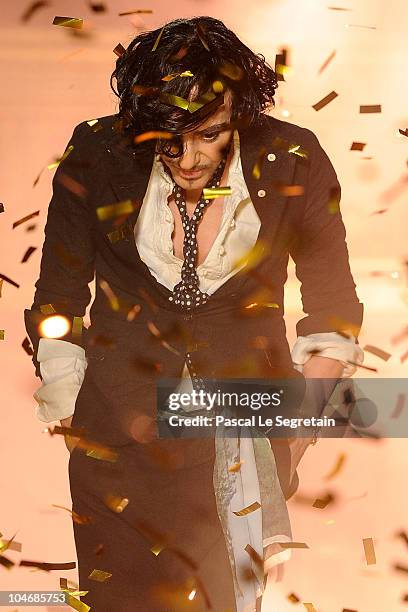 Designer John Galliano walks the runway during the John Galliano Ready to Wear Spring/Summer 2011 show during Paris Fashion Week at Opera Comique on...