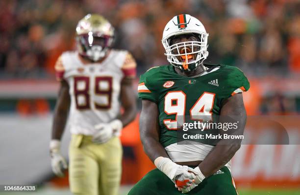 Tito Odenigbo of the Miami Hurricanes celebrates after making a tackle in the second half against the Florida State Seminoles at Hard Rock Stadium on...