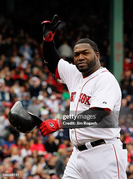 David Ortiz of the Boston Red Sox waves to fans after he was replaced by a pinch runner against the New York Yankees at Fenway Park, October 3 in...