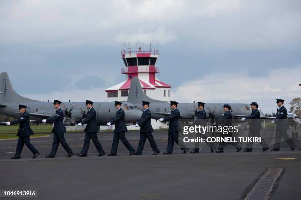 New Zealand Defence Force personnel march during an arrival ceremony for the repatriated remains of two New Zealand military servicemen, navy...