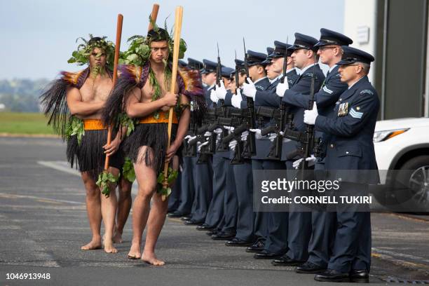 Welcoming party performs a haka tribute during an arrival ceremony for the repatriated remains of two New Zealand military servicemen, navy...