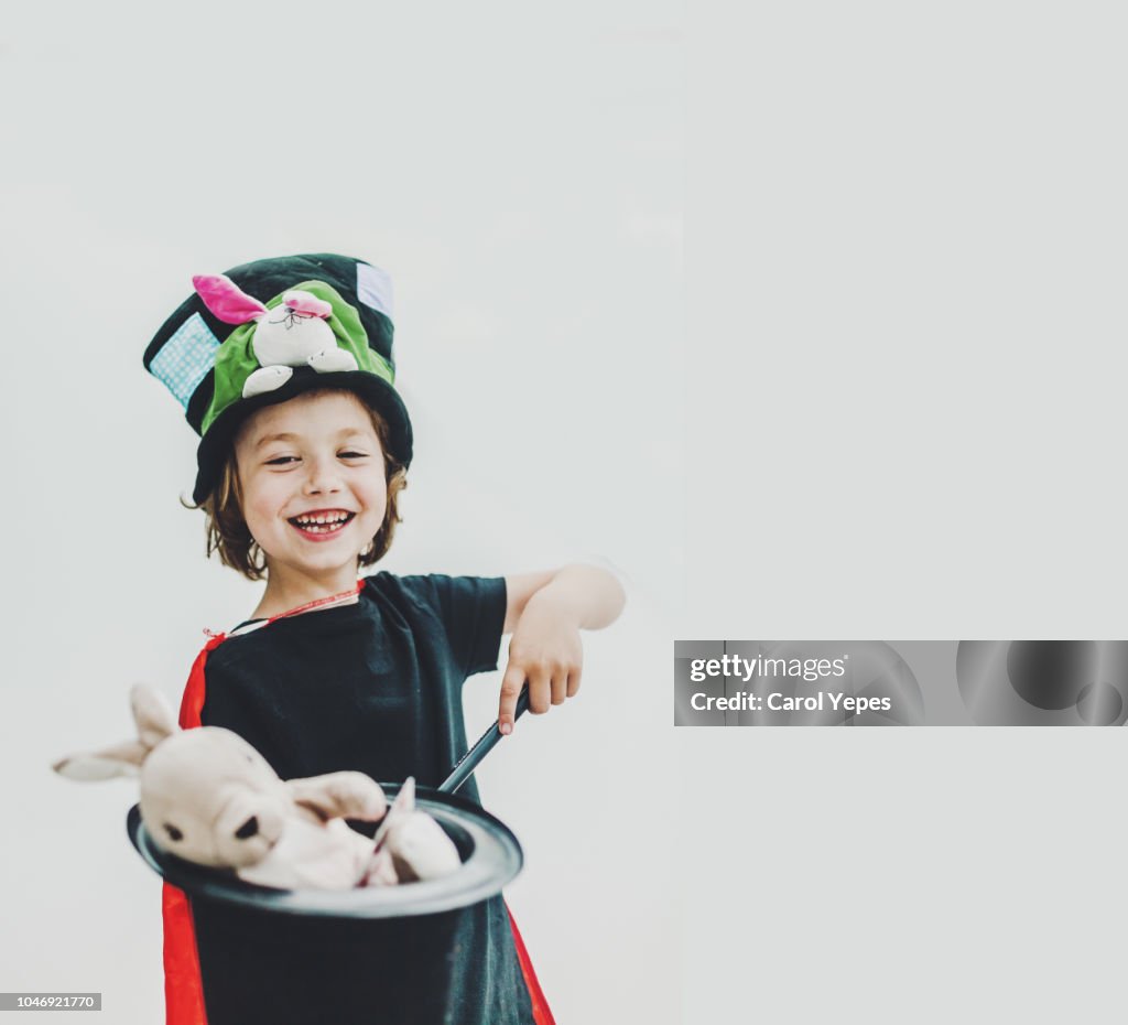 Happy boy performing a magic trick