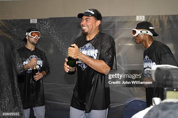 Sean Rodriguez, Joaquin Benoit, and B.J. Upton of Tampa Bay Rays celebrate in the clubhouse after the game against Kansas City Royals on October 3,...