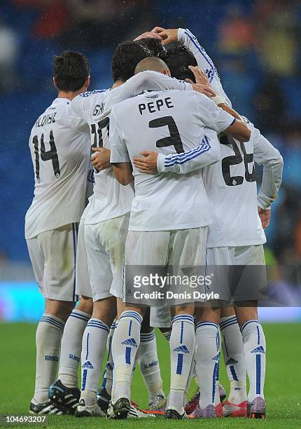 Pepe of Real Madrid celebrates with teammates after Cristiano Ronaldo scored Real's sixth goal during the La Liga match against Deportivo La Coruna...