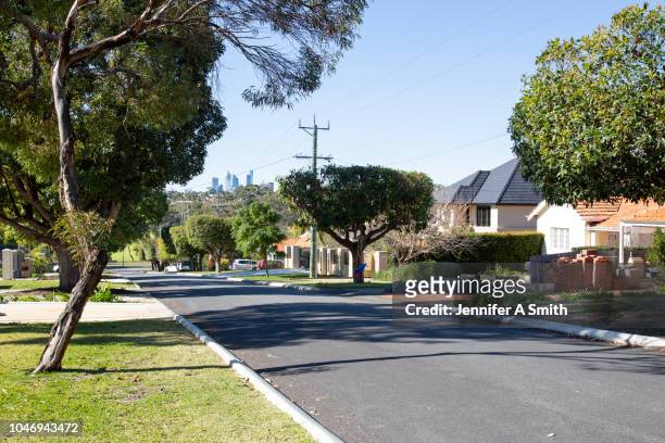 perth city from suburban street. - australia street stockfoto's en -beelden