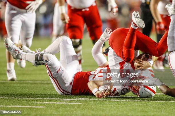 Nebraska quarterback Andrew Bunch is sacked by Wisconsin outside linbacker Tyler Johnson during a college football game between the University of...