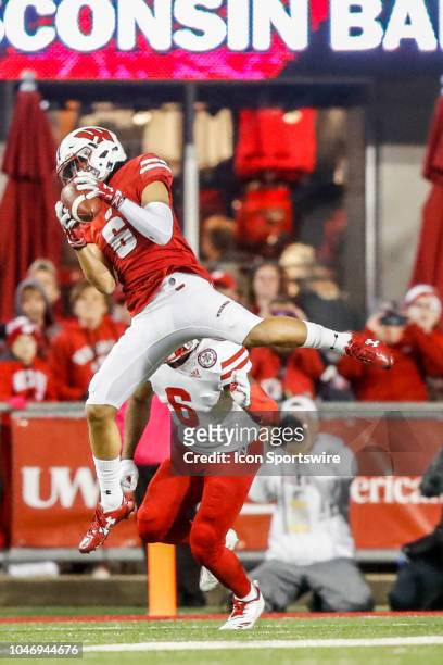 Wisconsin wide receiver Danny Davis III makes a catch in front of Nebraska defensive back Eric Lee Jr. During a college football game between the...