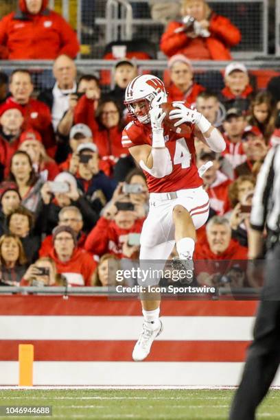 Wisconsin tight end Jake Ferguson catches the ball in the end zone for a touchdown during a college football game between the University of Wisconsin...