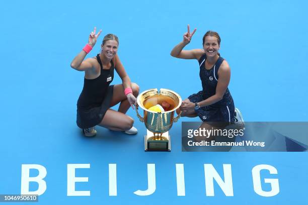 Andrea Sestini Hlavackova and Barbora Strycova of Czech Republic poses with the trophy during the medal ceremony after the Women's doubles final...
