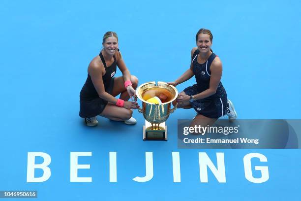 Andrea Sestini Hlavackova and Barbora Strycova of Czech Republic poses with the trophy during the medal ceremony after the Women's doubles final...