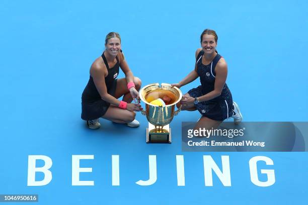 Andrea Sestini Hlavackova and Barbora Strycova of Czech Republic poses with the trophy during the medal ceremony after the Women's doubles final...