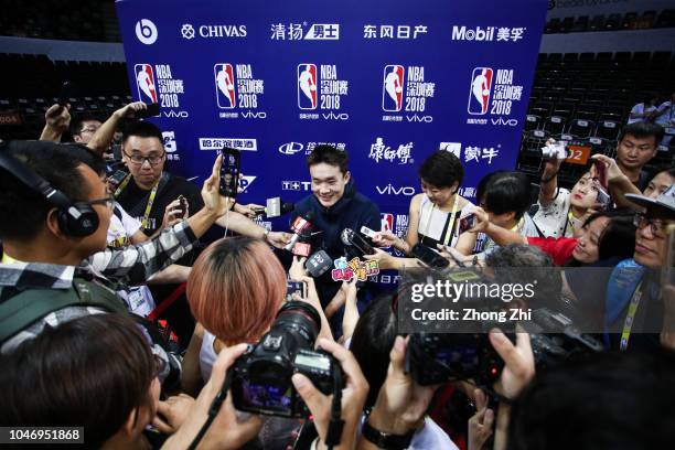 Ding Yanyuhang of the Dallas Mavericks speaks to media during the practice as part of the 2018 NBA China Games between the Dallas Mavericks and the...